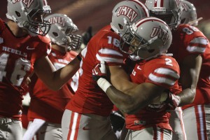 The Rebels celebrate an Adonis Smith 4-yd TD run in the third quarter. 