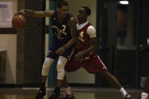 Former UNLV Rebel Anthony Marshall (Mojave) battles for post position against incoming UNLV senior Kevin Olekaibe during the second week of action at the Desert Reign ProCity League over the summer.