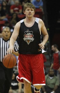 Former Runnin’ Rebel Joe Darger brings up the basketball during the Legends game. 