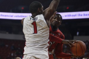 UNLV junior Deville Smith prepares to pass the ball around defender Roscoe Smith during the second half of the scrimmage.