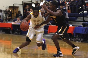 Durango senior guard Darryl Gaynor drives against a defender from Bishop O'Dowd during day 2 of the Tarkanian Classic.