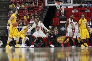 The Rebels play defense against the Cowboys in the first half of UNLV's MWC quarterfinal game against Wyoming.