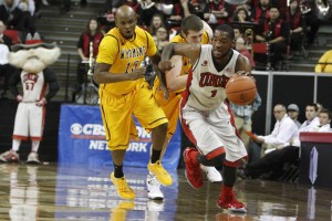 UNLV forward Roscoe Smith dribbles the ball in transition in the first half of UNLV's MWC quarterfinal game against Wyoming. He returned tonight after missing the final two regular season games with a concussion.