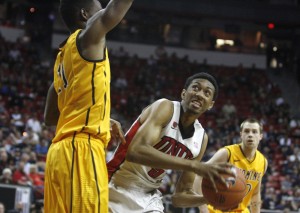 UNLV forward Chris Wood battles for post position against Wyoming forward Derek Cooke Jr. in the second half of UNLV's MWC quarterfinal game against Wyoming.