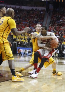 UNLV guard Deville Smith is swarmed by a group of Cowboys in the second half of UNLV's MWC quarterfinal game against Wyoming.