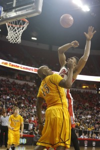 UNLV center Khem Birch is fouled going up for a shot in the second half of UNLV's MWC quarterfinal game against Wyoming. He finished with 8 points and 9 rebounds despite playing with hip flexor injury.