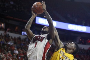 UNLV forward Roscoe Smith takes the contact while going for a bucket in the second half of UNLV's MWC quarterfinal game against Wyoming.
