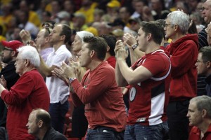 A group of Runnin' Rebel fans celebrate late in the second half of UNLV's MWC quarterfinal game against Wyoming.