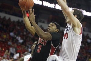 UNLV guard Kevin Olekaibe drives to the basket in the first half of UNLV's MWC semifinal game against San Diego St.