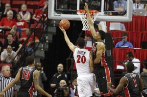UNLV center Khem Birch attempts to block a JJ O'Brien layup in the first half of UNLV's MWC semifinal game against San Diego St. Birch had a game-high 5 blocks.