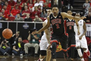 UNLV center Khem Birch reacts as SDSU forward JJ O'Brien pokes the ball away, stopping a Rebel transition break in the second half of UNLV's MWC semifinal game against San Diego St. 