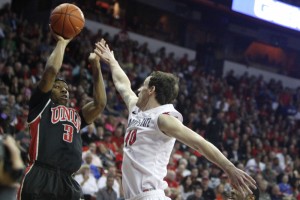 UNLV guard Kevin Olekaibe pulls up against SDSU forward Matt Shrigley in the second half of UNLV's MWC semifinal game against San Diego St.