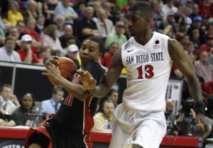 UNLV guard Daquan Cook drives into the lane against SDSU forward Winston Shepard in the second half of UNLV's MWC semifinal game against San Diego St.