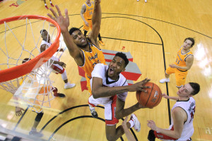 UNLV forward Derrick Jones Jr. drives to the basket past Wyoming forward Jordan Naughton during their Mountain West Conference game Saturday, Feb. 27, 2016, at the Thomas & Mack Center. UNLV won the game 79-74. CREDIT: Sam Morris/Las Vegas News Bureau